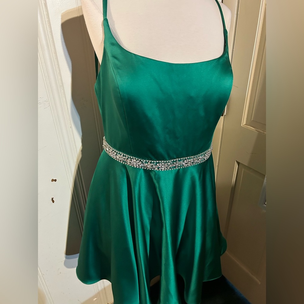 Size 16 Green formal dress can be worn for a formally event or homecoming event